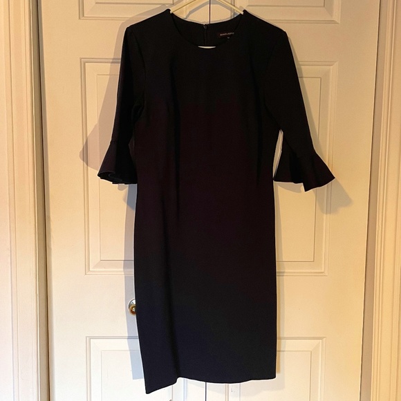 Navy work dress with circular flounce sleeve. - Picture 1 of 2